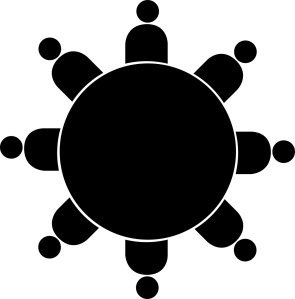 Symbolfoto Gruppe schwarze Figuren um schwarzen Tisch